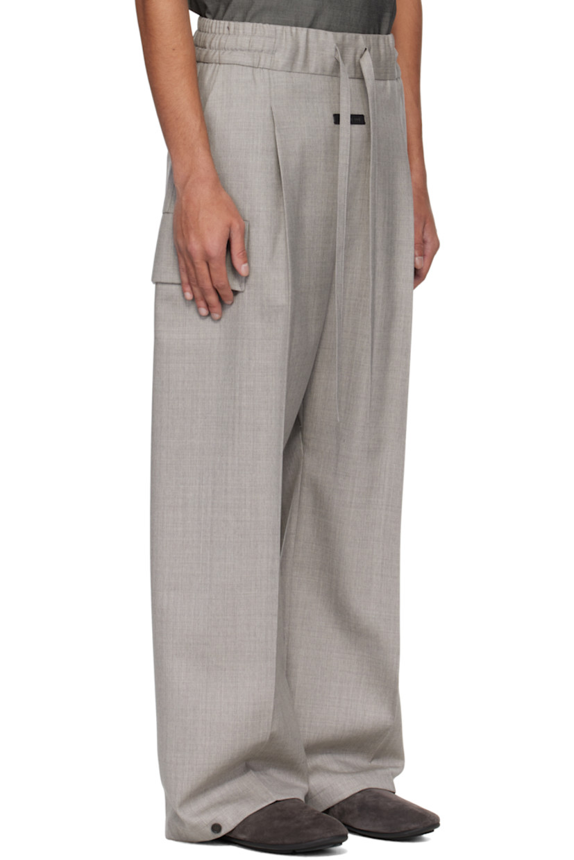 Wide-leg virgin wool tweed cargo pants. 

· Drawstring at elasticized waistband 
· Two-pocket styling 
· Rubberized logo patch and pleats at front 
· Adjustable press-stud fastening at cuffs 
· Patch pocket at outseams 
· Creased legs 

Supplier color: Melange grey