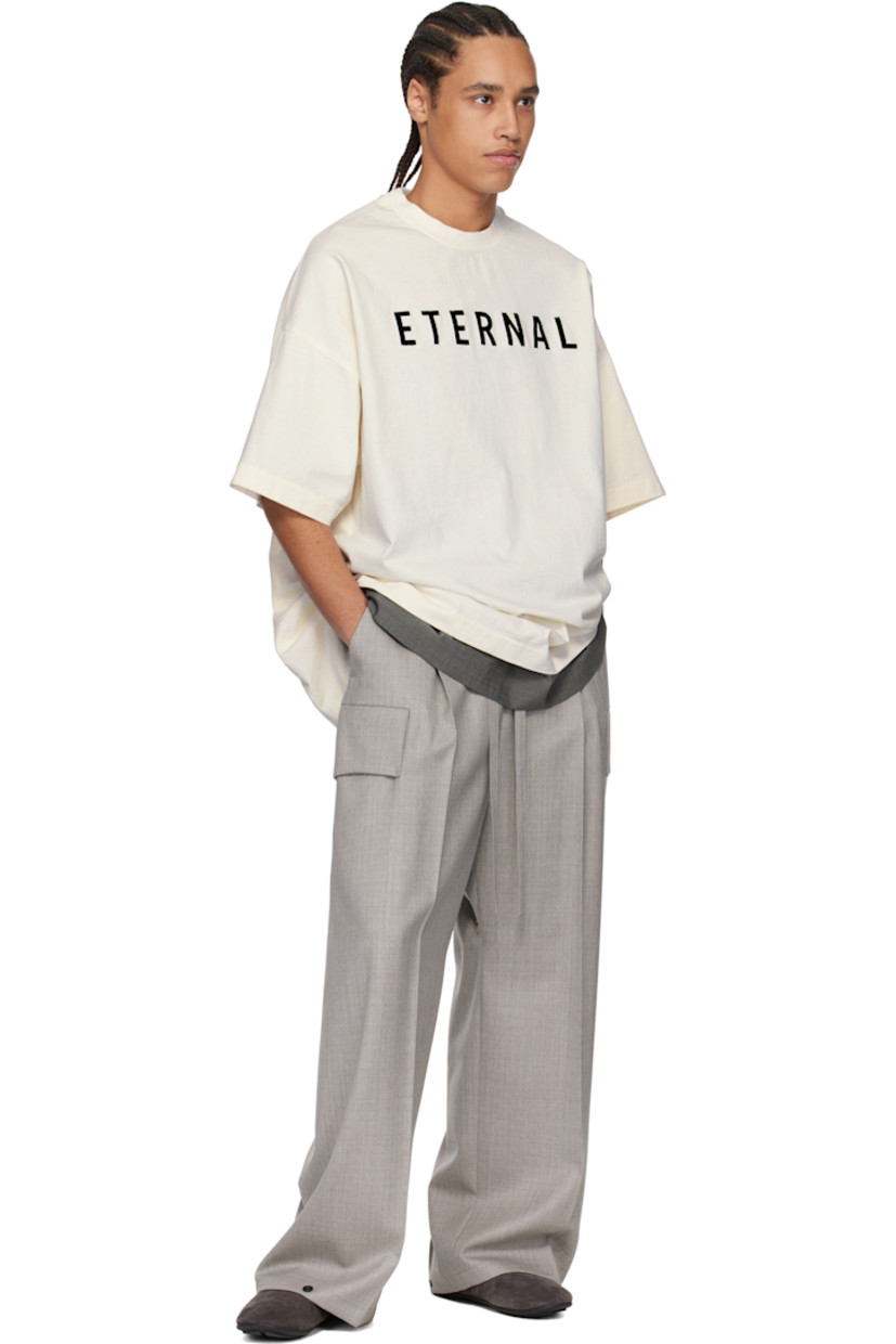 Wide-leg virgin wool tweed cargo pants. 

· Drawstring at elasticized waistband 
· Two-pocket styling 
· Rubberized logo patch and pleats at front 
· Adjustable press-stud fastening at cuffs 
· Patch pocket at outseams 
· Creased legs 

Supplier color: Melange grey