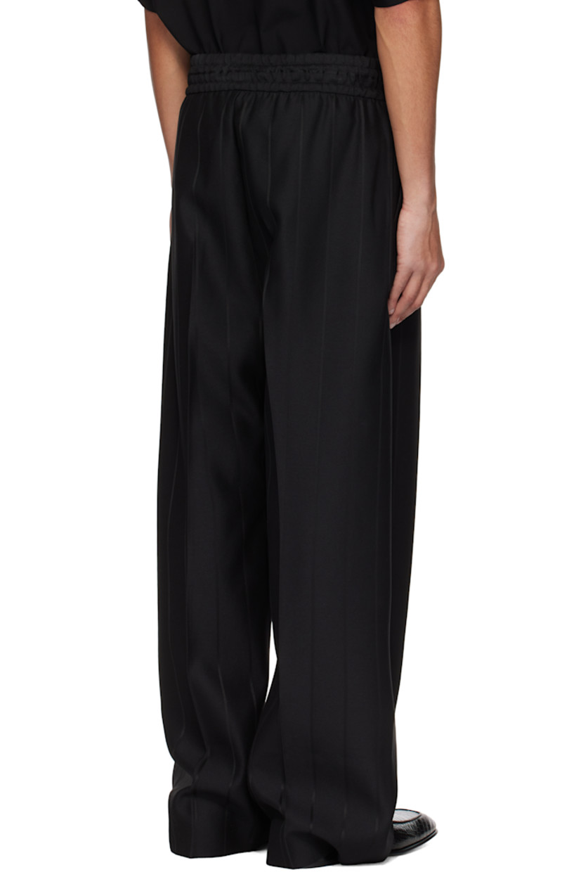 Heavyweight viscose- and virgin wool-blend twill trousers. Stripes throughout. 

· Wide-leg
· Drawstring at elasticized waistband 
· Two-pocket styling 
· Pleats and rubberized logo patch at front 
· Creased legs 
· Full satin lining 

Supplier color: Black