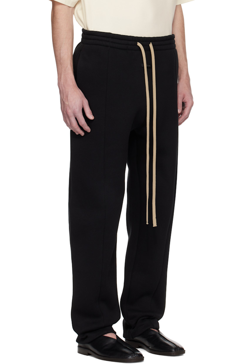 Heavyweight cotton-blend fleece sweatpants. 

· Loose-fit and straight-leg
· Drawstring at elasticized waistband 
· Two-pocket styling
· Rubberized logo patch at front
· Central seam at front legs
· Dropped inseam 
· Elasticized cuffs

Supplier color: Black