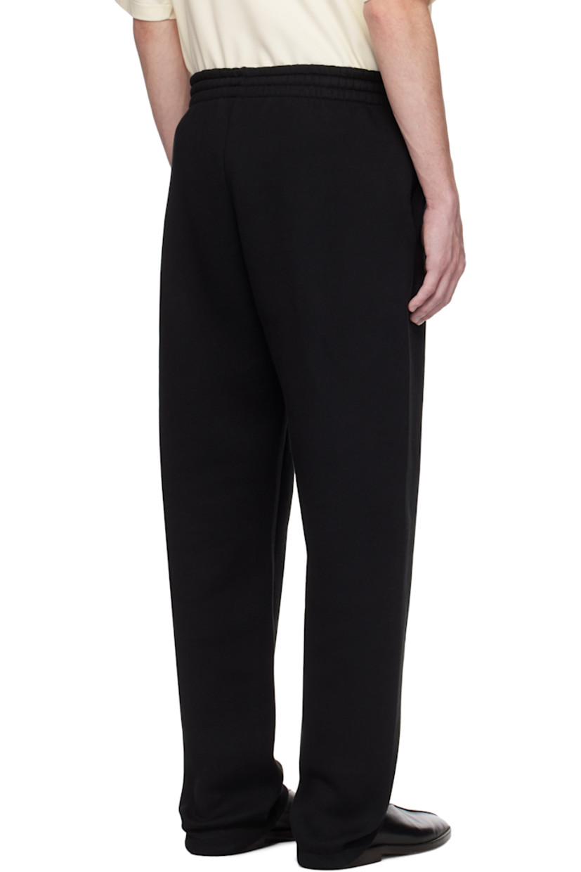 Heavyweight cotton-blend fleece sweatpants. 

· Loose-fit and straight-leg
· Drawstring at elasticized waistband 
· Two-pocket styling
· Rubberized logo patch at front
· Central seam at front legs
· Dropped inseam 
· Elasticized cuffs

Supplier color: Black