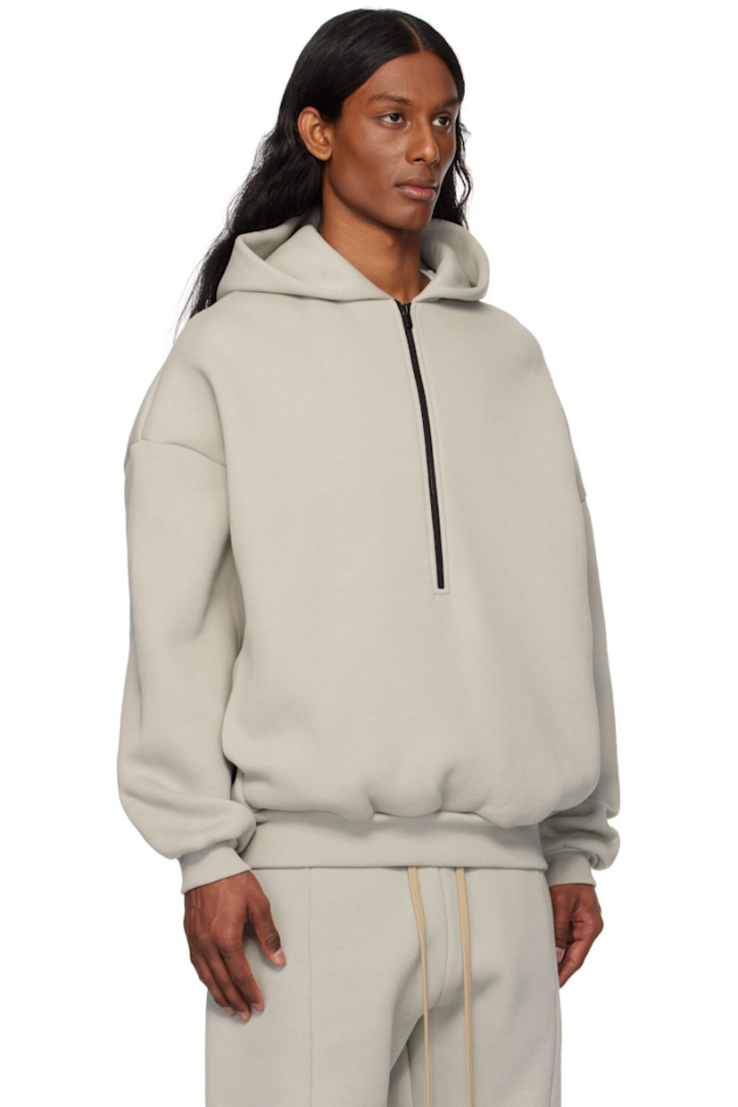 Cotton-blend fleece hoodie.

· Logo patch at hood
· Half zip closure
· Seam pockets
· Rib-knit hem and cuffs
· Dropped shoulders
· Text embossed at back

Part of the Eternal collection.

Supplier color: Dove grey