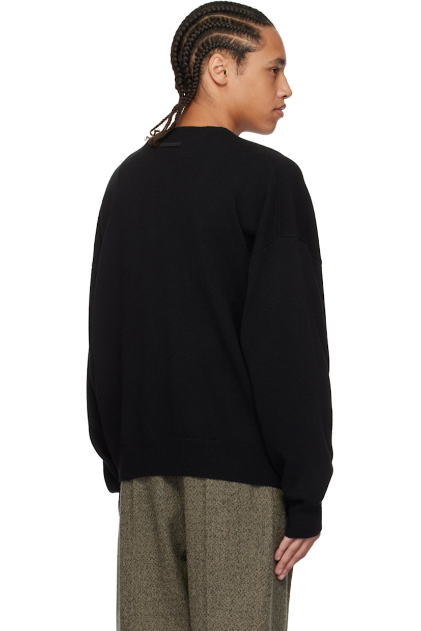 Knit extrafine merino wool henley. 

· Single-button closure at crewneck 
· Rib-knit hem and cuffs 
· Dropped shoulders 
· Rubberized logo patch at back collar 

Supplier color: Black