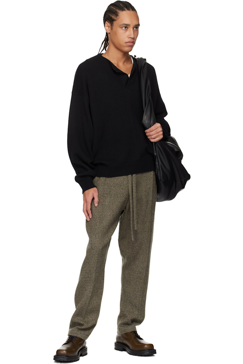 Knit extrafine merino wool henley. 

· Single-button closure at crewneck 
· Rib-knit hem and cuffs 
· Dropped shoulders 
· Rubberized logo patch at back collar 

Supplier color: Black