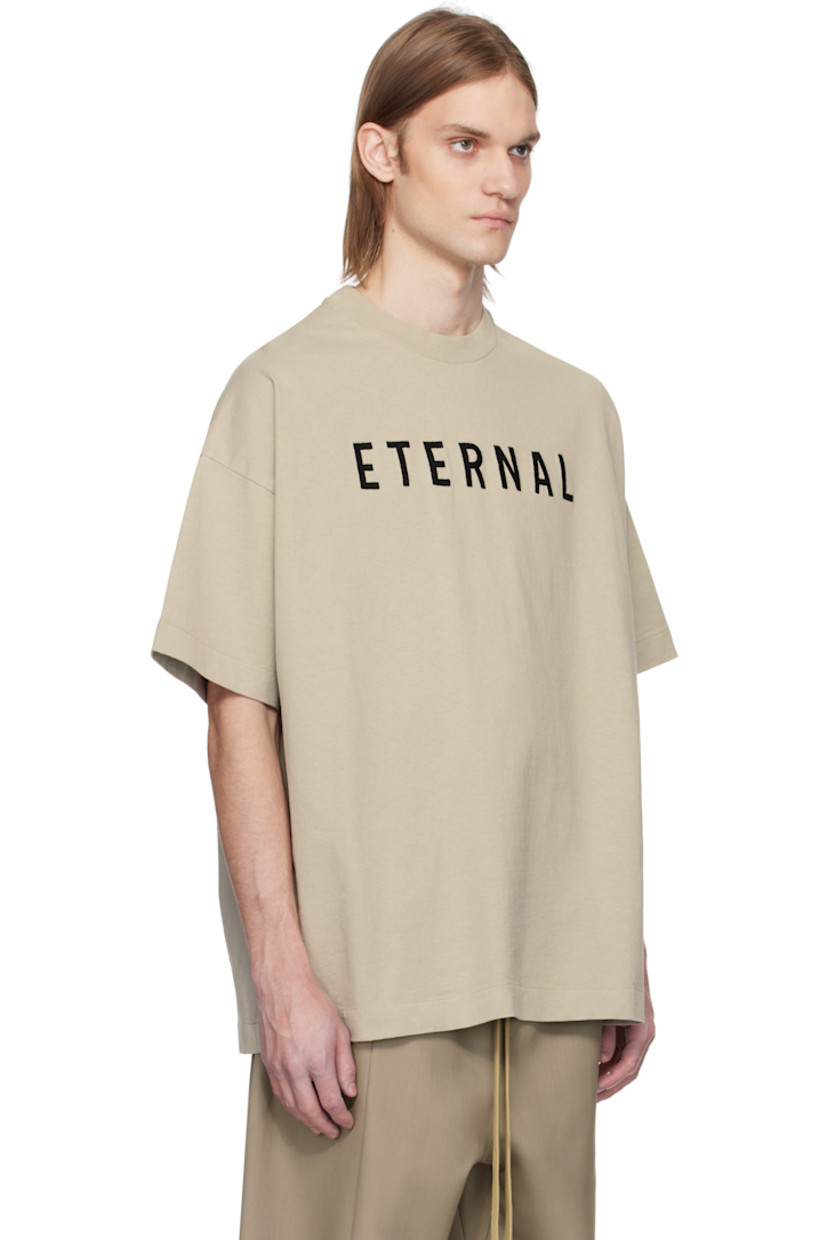 Heavyweight cotton jersey T-shirt. 

· Rib-knit crewneck
· Text embroidered at chest
· Dropped shoulders 
· Rubberized logo patch at back collar

Supplier color: Dove grey