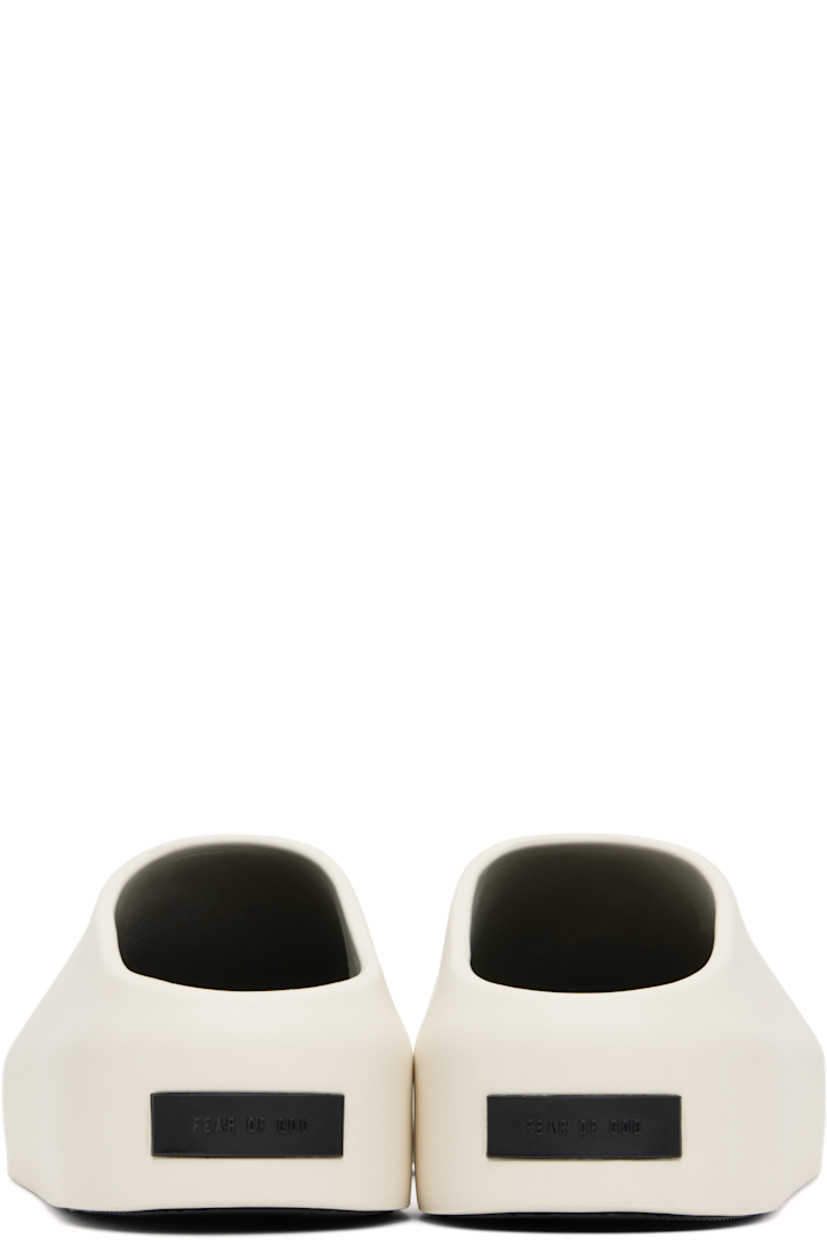 Foam rubber slip-on loafers in off-white.

· Rubber logo patch at heel 
· Removable logo-embossed buffed leather insole
· Extrabounce foam rubber midsole
· Treaded XL Extralight® rubber outsole

Supplier color: Cream