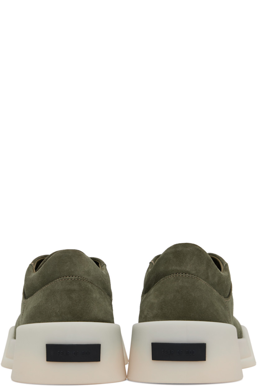 Low-top nubuck sneakers in khaki. 

· Lace-up closure
· Padded tongue and collar
· Rubber logo patch at heel
· Suede and buffed leather lining
· Rubber sole

Supplier color: Forest