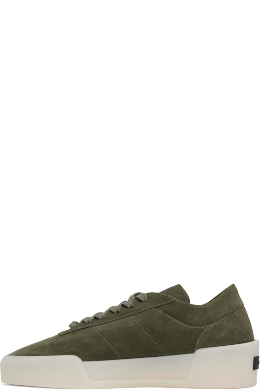 Low-top nubuck sneakers in khaki. 

· Lace-up closure
· Padded tongue and collar
· Rubber logo patch at heel
· Suede and buffed leather lining
· Rubber sole

Supplier color: Forest