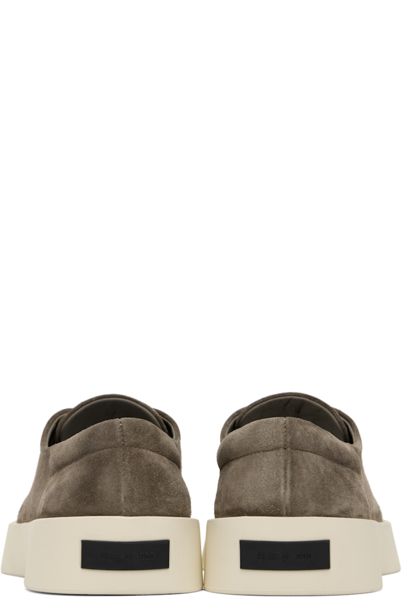 Low-top suede sneakers in taupe. 

· Lace-up closure
· Padded collar 
· Rubber logo patch at heel
· Buffed leather lining
· Rubber sole

Available exclusively at SSENSE. 

Supplier color: Taupe
