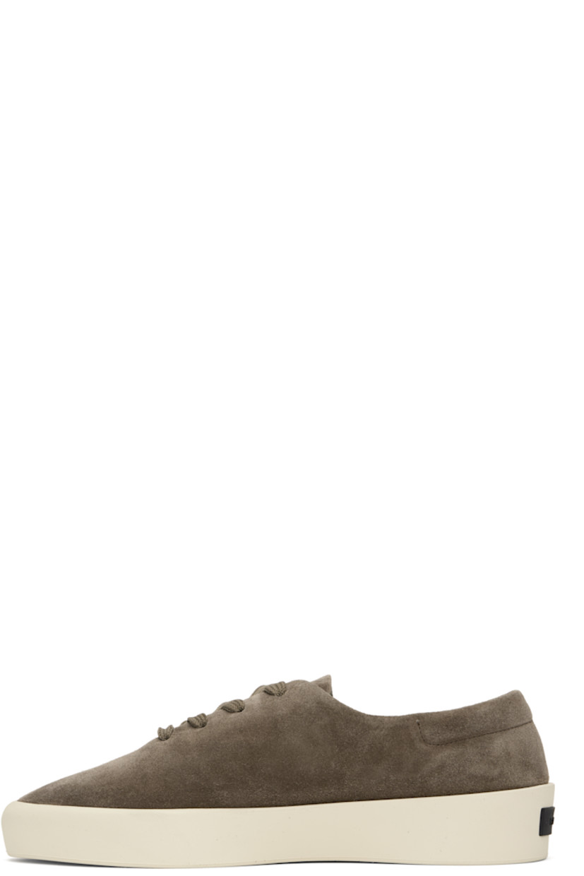 Low-top suede sneakers in taupe. 

· Lace-up closure
· Padded collar 
· Rubber logo patch at heel
· Buffed leather lining
· Rubber sole

Available exclusively at SSENSE. 

Supplier color: Taupe