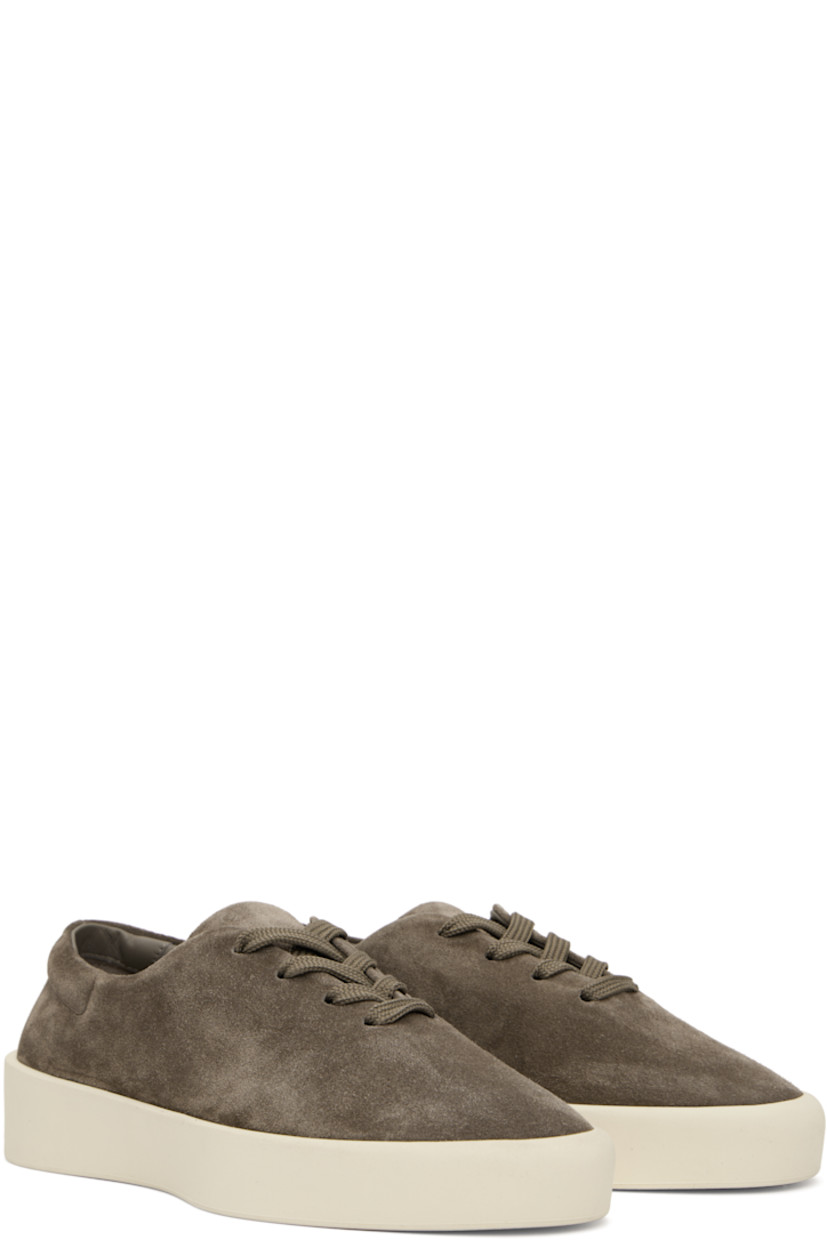 Low-top suede sneakers in taupe. 

· Lace-up closure
· Padded collar 
· Rubber logo patch at heel
· Buffed leather lining
· Rubber sole

Available exclusively at SSENSE. 

Supplier color: Taupe