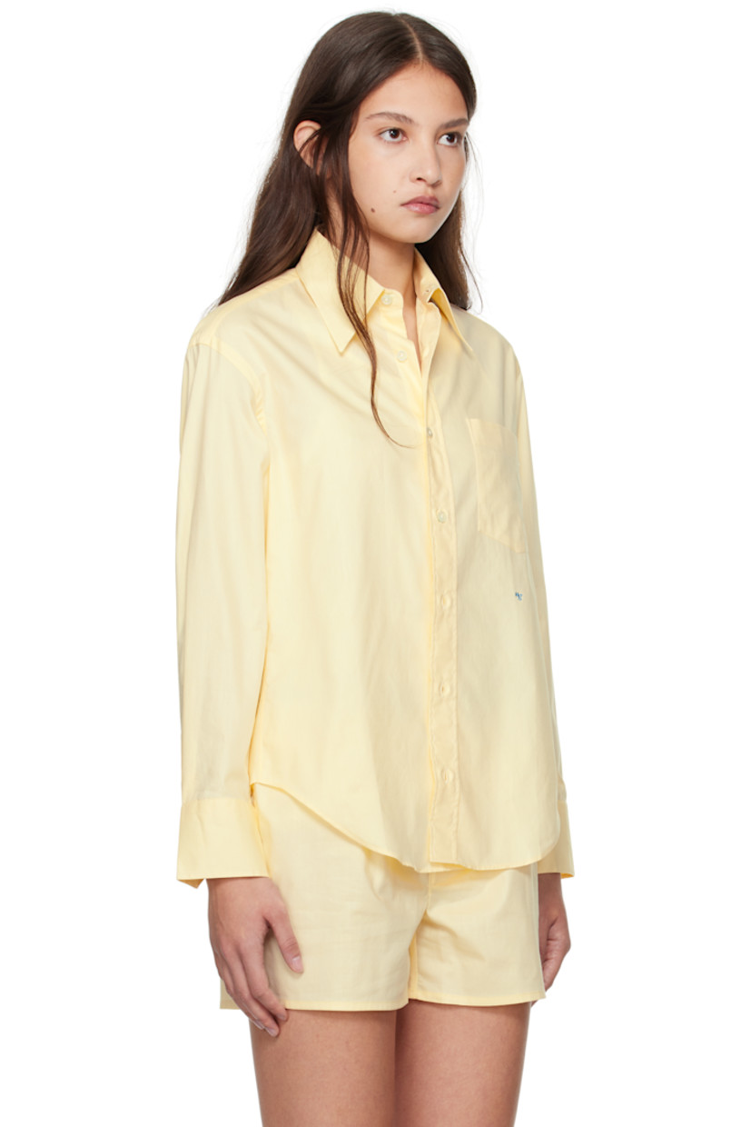 Cotton poplin shirt.

· Spread collar 
· Button closure 
· Patch pocket at chest
· Logo embroidered at front
· Shirttail hem
· Pleat at single-button barrel cuffs

Supplier color: Yellow