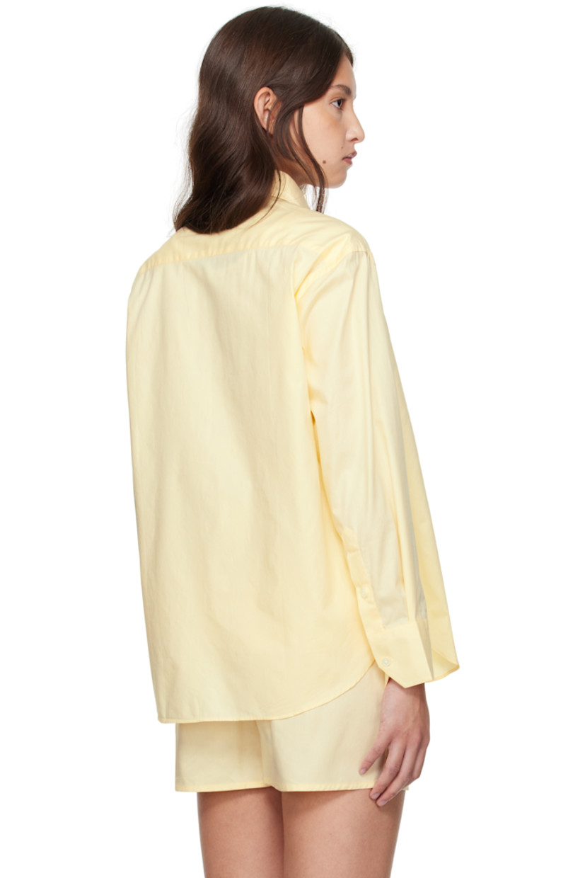 Cotton poplin shirt.

· Spread collar 
· Button closure 
· Patch pocket at chest
· Logo embroidered at front
· Shirttail hem
· Pleat at single-button barrel cuffs

Supplier color: Yellow
