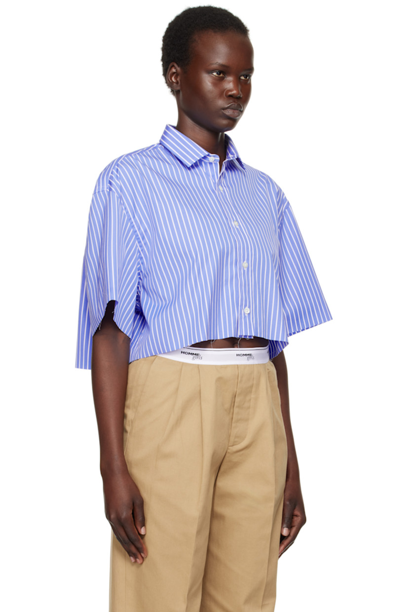 Oversized cotton poplin shirt. Stripes throughout.

· Spread collar
· Button closure
· Logo embroidered at front
· Cropped hem
· Raw edge at hem and cuffs
· Dropped shoulders
· Box pleat at back yoke

Supplier color: Blue stripe