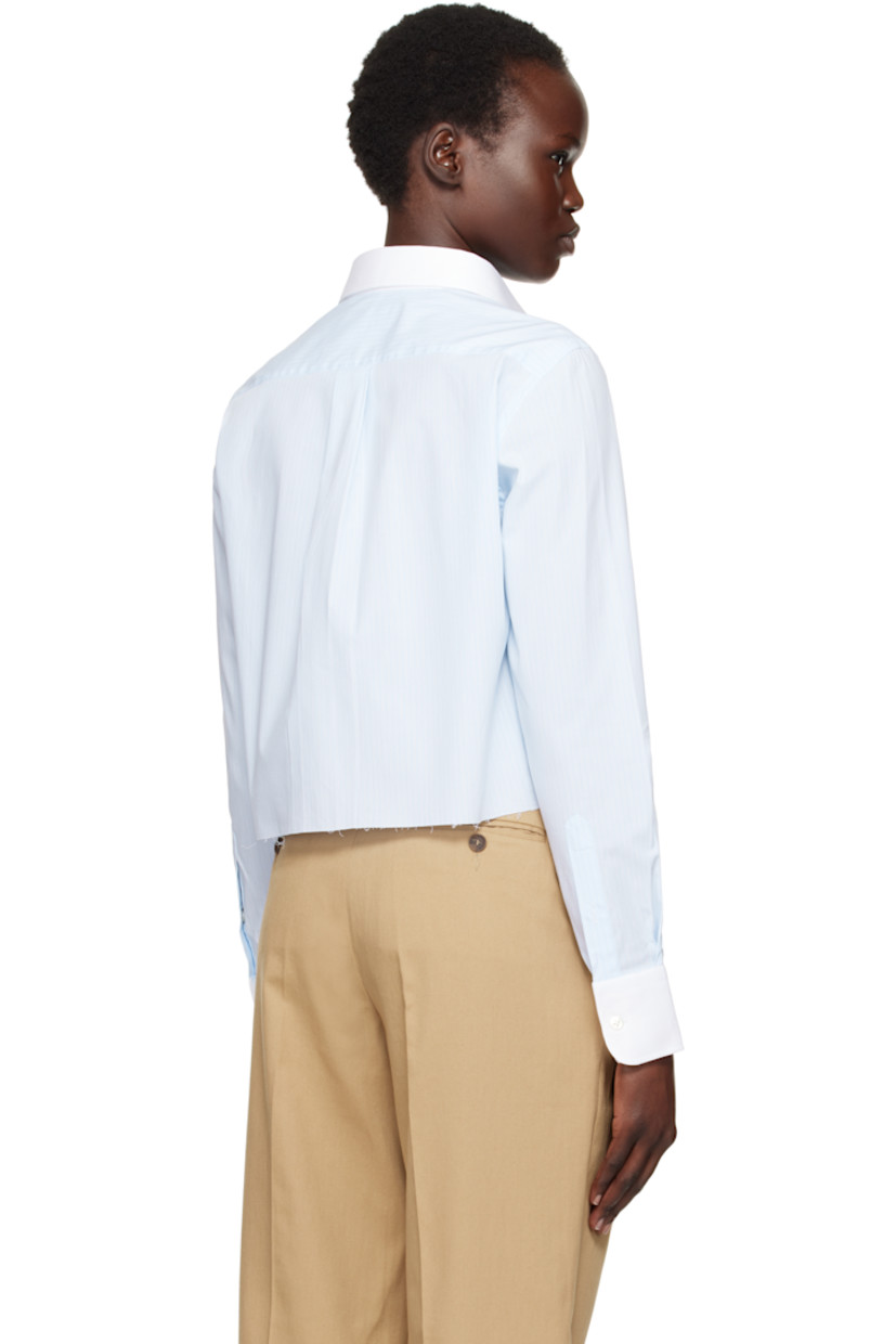Stretch cotton chambray shirt. Stripes throughout.

· Spread collar
· Button closure
· Logo embroidered at front
· Raw edge at cropped hem
· Pleat at adjustable single-button barrel cuffs
· Box pleat at back yoke

Supplier color: Ticking stripe