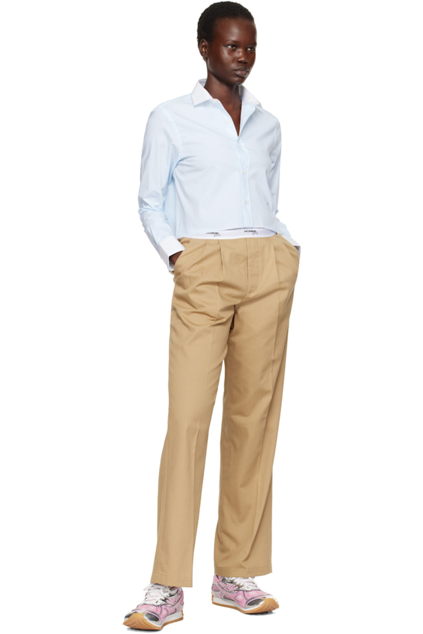 Stretch cotton chambray shirt. Stripes throughout.

· Spread collar
· Button closure
· Logo embroidered at front
· Raw edge at cropped hem
· Pleat at adjustable single-button barrel cuffs
· Box pleat at back yoke

Supplier color: Ticking stripe