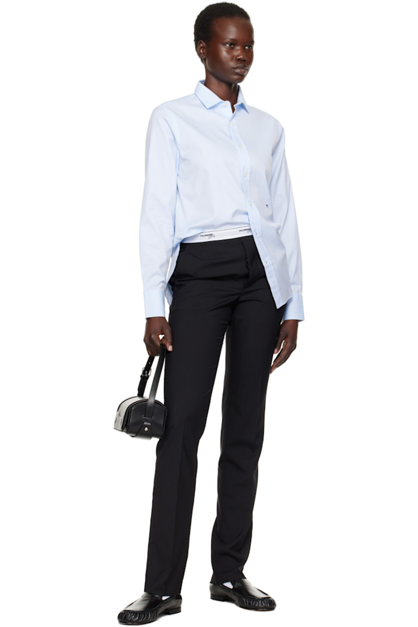 Cotton twill shirt.

· Spread collar
· Button closure
· Logo embroidered at front
· Shirttail hem
· Pleat at adjustable single-button barrel cuffs
· Box pleat at back yoke

Supplier color: Chambray blue