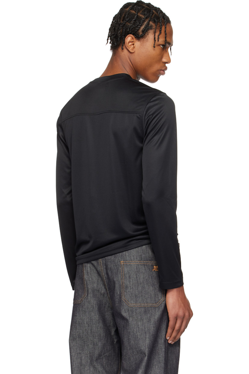 Polyester jersey T-shirt. 

· Crewneck
· Logo embroidered at chest 
· Logo flag at front hem
· Logo printed at back collar

Supplier color: Black