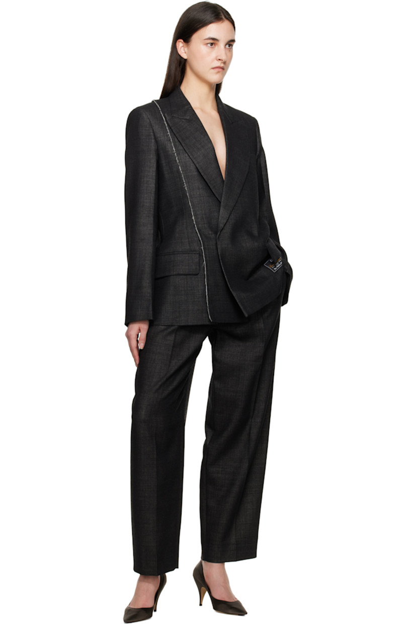 Virgin wool-blend delaine blazer. Raw edges throughout.

· Peaked lapel
· Double-breasted button closure
· Welt pocket at chest
· Flap pockets
· Logo patch at front hem
· Padded shoulders
· Vented back hem
· Welt pocket at interior
· Full viscose satin lining

Supplier color: Black