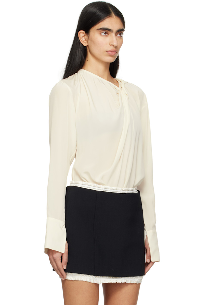 Silk crepe de chine blouse. Gathering throughout.

· Twisting and zip fastening at crewneck
· Vented cuffs
· Self-tie strap at back collar

Supplier color: Ivory