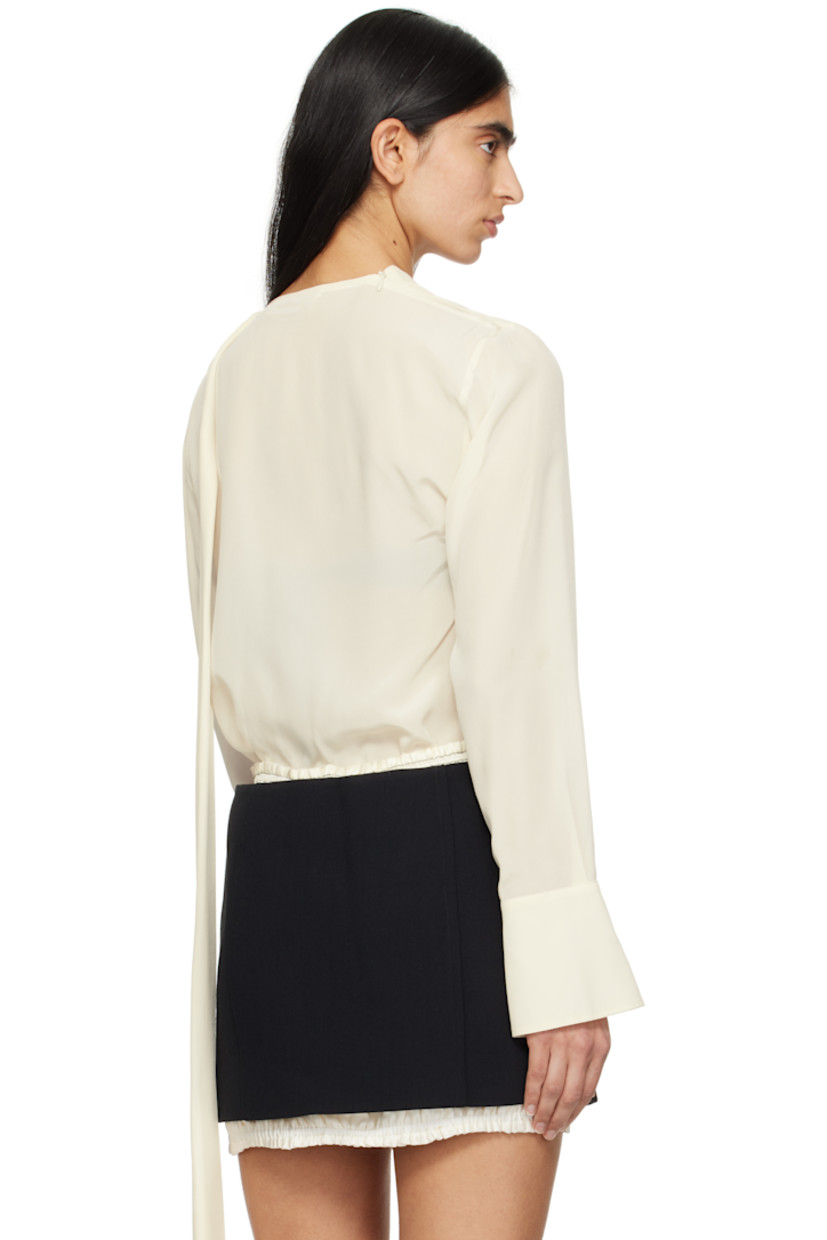 Silk crepe de chine blouse. Gathering throughout.

· Twisting and zip fastening at crewneck
· Vented cuffs
· Self-tie strap at back collar

Supplier color: Ivory
