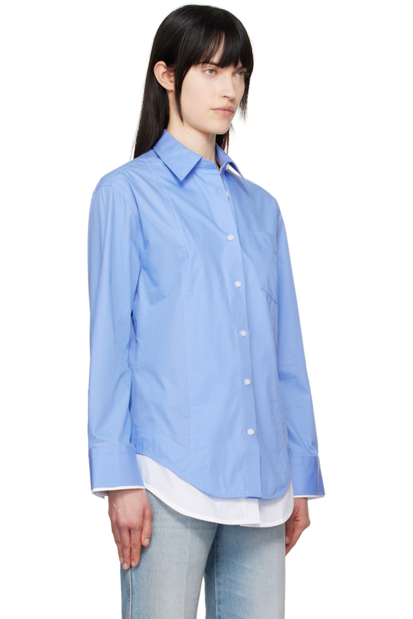 Organic cotton poplin shirt.

· Layered construction
· Spread collar
· Button closure
· Patch pocket at chest
· Logo embroidered at front
· Shirttail hem
· Single-button barrel cuffs

Supplier color: Oxford blue