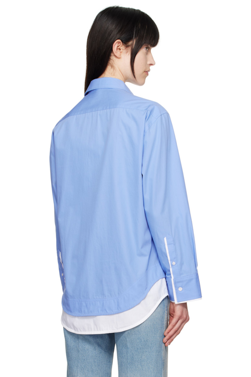 Organic cotton poplin shirt.

· Layered construction
· Spread collar
· Button closure
· Patch pocket at chest
· Logo embroidered at front
· Shirttail hem
· Single-button barrel cuffs

Supplier color: Oxford blue