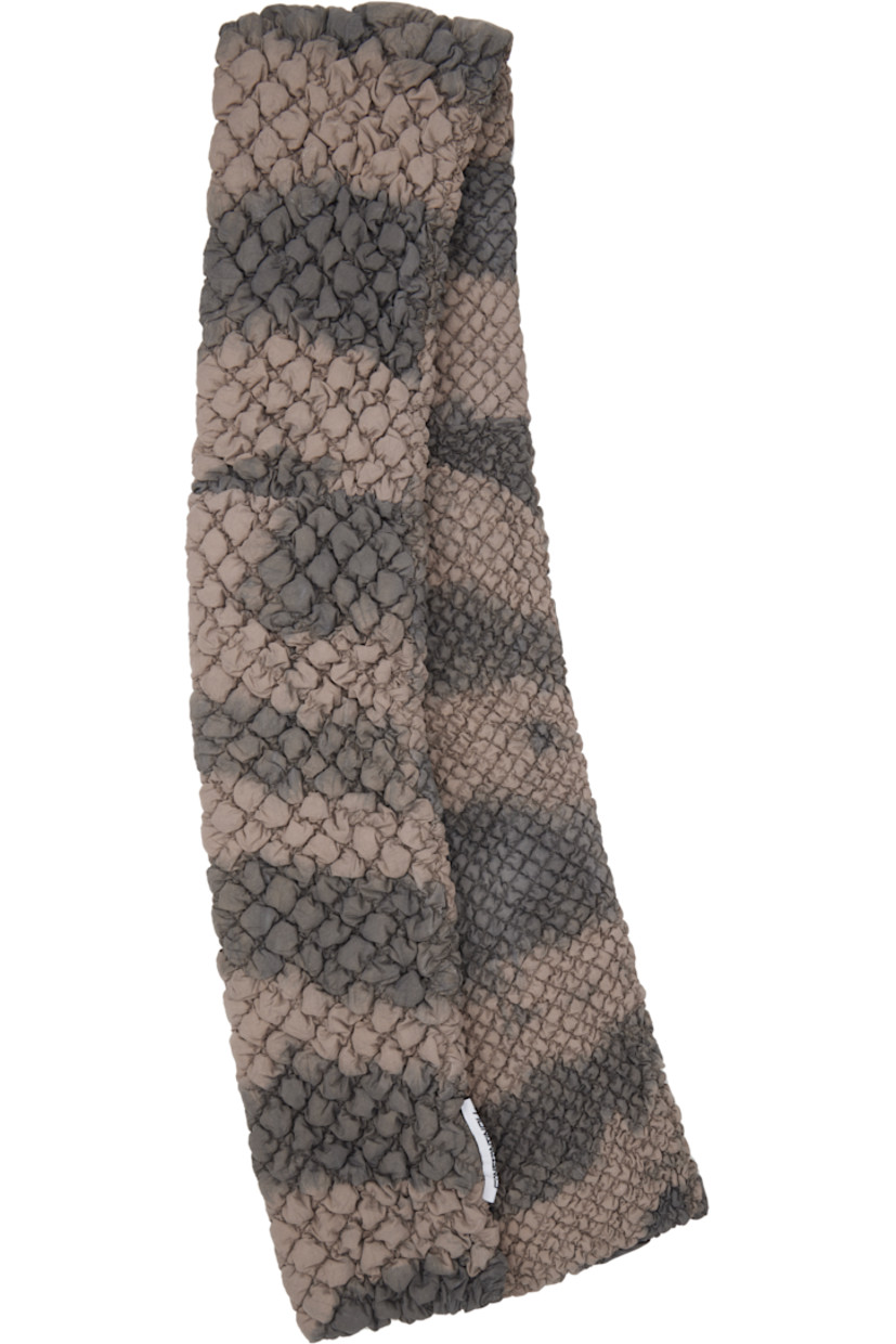 Shirred satin scarf in taupe. 

· Down-filled and mineral-dyed 
· Logo patch at end
· L64" x W6"

Available exclusively at SSENSE.

Supplier color: Dark brown/Light brown 

Fill: 90% down, 10% feather.
