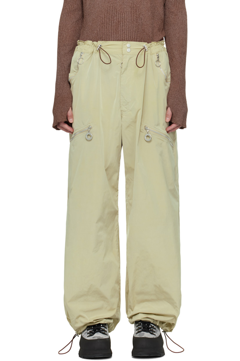 Hand- and garment-dyed nylon taffeta cargo pants.

· Bungee-style drawstring at elasticized waistband and cuffs
· Two-pocket styling
· Zip fly
· Zip pockets at front
· Logo-engraved silver-tone hardware

Supplier color: Beige dip