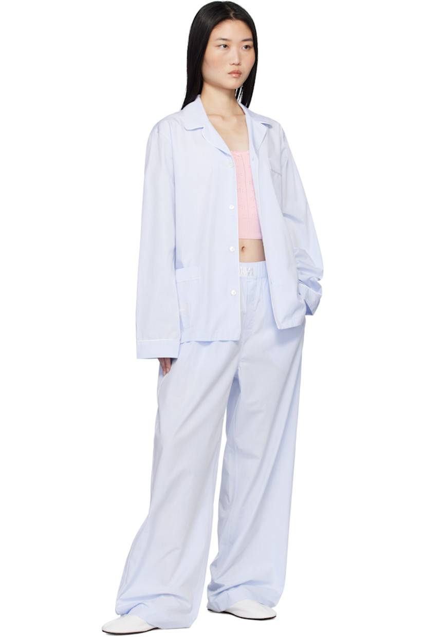 Mercerized Supima® cotton poplin pyjama pants. Jacquard polka-dot pattern throughout.

· 300 thread count
· Concealed drawstring at elasticized waistband
· Logo patch at waistband
· Two-pocket styling 
· Button fly 
· Vented cuffs
· Piping at outseams 

Supplier color: Light blue dots
