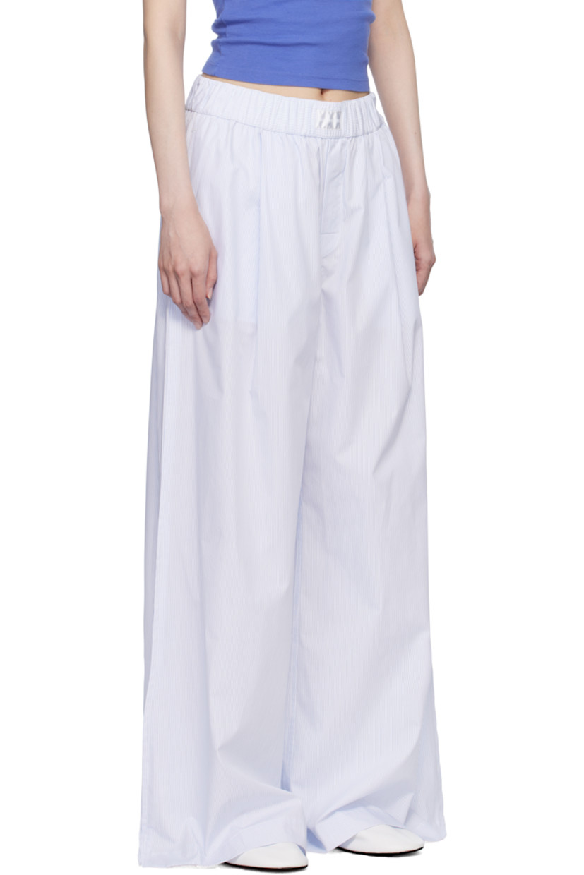 Mercerized Supima® cotton poplin pyjama pants. Stripes throughout.

· Wide-leg 
· 300 thread count
· Concealed drawstring at elasticized waistband
· Logo patch at waistband
· Three-pocket styling 
· Button fly 
· Pleats at front
· Vented cuffs
· Mother-of-pearl hardware

Supplier color: Light blue stripes