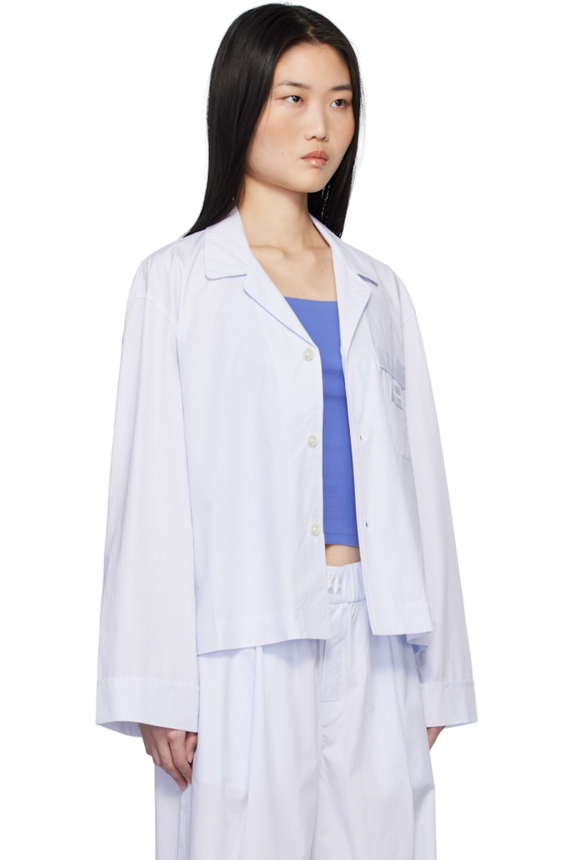 Mercerized Supima® cotton poplin pyjama shirt. Stripes throughout.

· 300 thread count
· Open spread collar
· Button closure
· Patch pocket at chest
· Logo patch at pocket
· Cropped hem
· Vented side seams 
· Locker loop at interior collar
· Mother-of-pearl hardware

Supplier color: Light blue stripes
