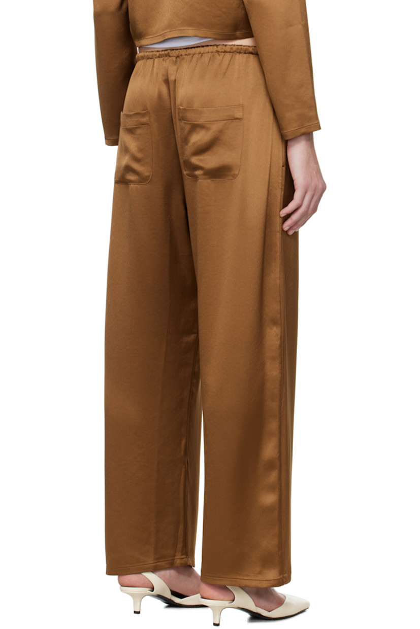 Loose-fit acetate-blend satin lounge pants.

· Drawstring at elasticized waistband
· Four-pocket styling
· Cropped leg

Supplier color: Henna