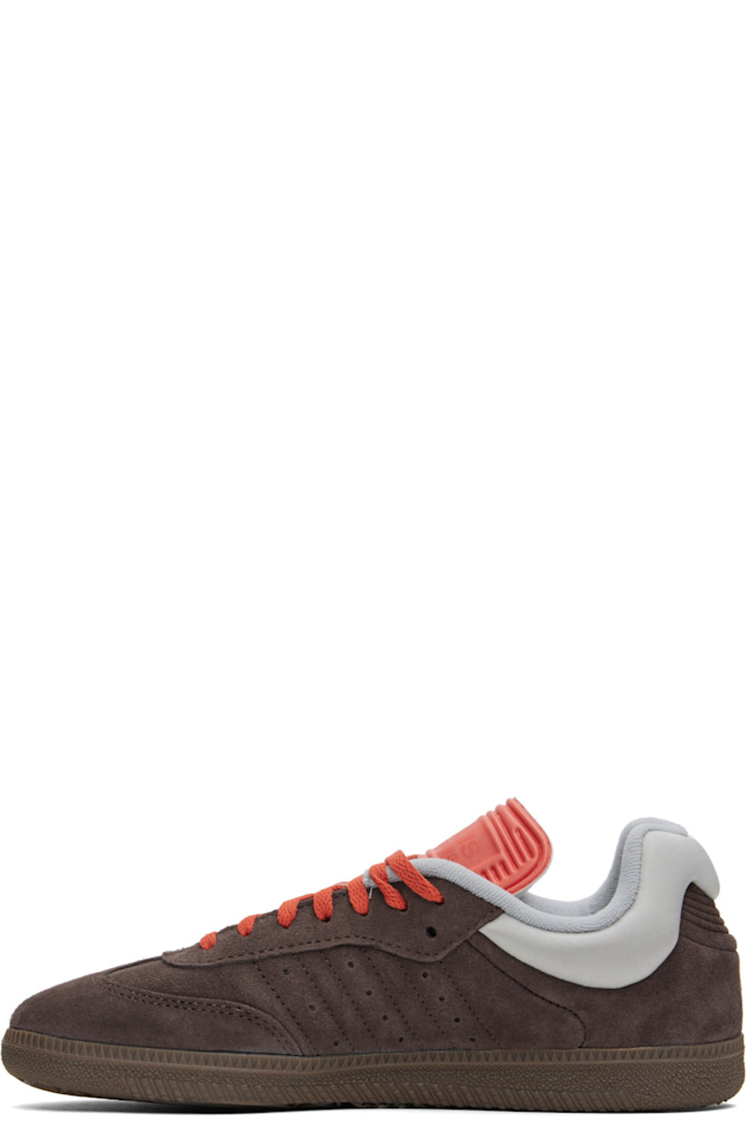 Low-top suede sneakers in brown.

· Lace-up closure
· Embossed detailing and logo at tongue
· Padded collar
· Perforations at sides
· Quilted signature stripes at sides
· Terrycloth lining
· Treaded rubber sole

Part of the Dingyun Zhang x adidas Originals collaboration.

Supplier color: Brown oxide/Brown oxide/Surf red
