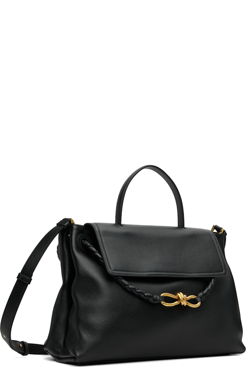 Buffed calfskin top handle bag.

· Fixed carry handle
· Knotted clasp at intrecciato-woven shoulder strap
· Detachable and adjustable crossbody strap
· Bumper studs at base
· Foldover flap with hook-eye fastening
· Alternate fastening at intrecciato-woven interior pocket
· Zip pocket at interior
· Bonded suede lining
· Gold-tone hardware
· H10.25" x W13.5" x D5"

Supplier color: Black
