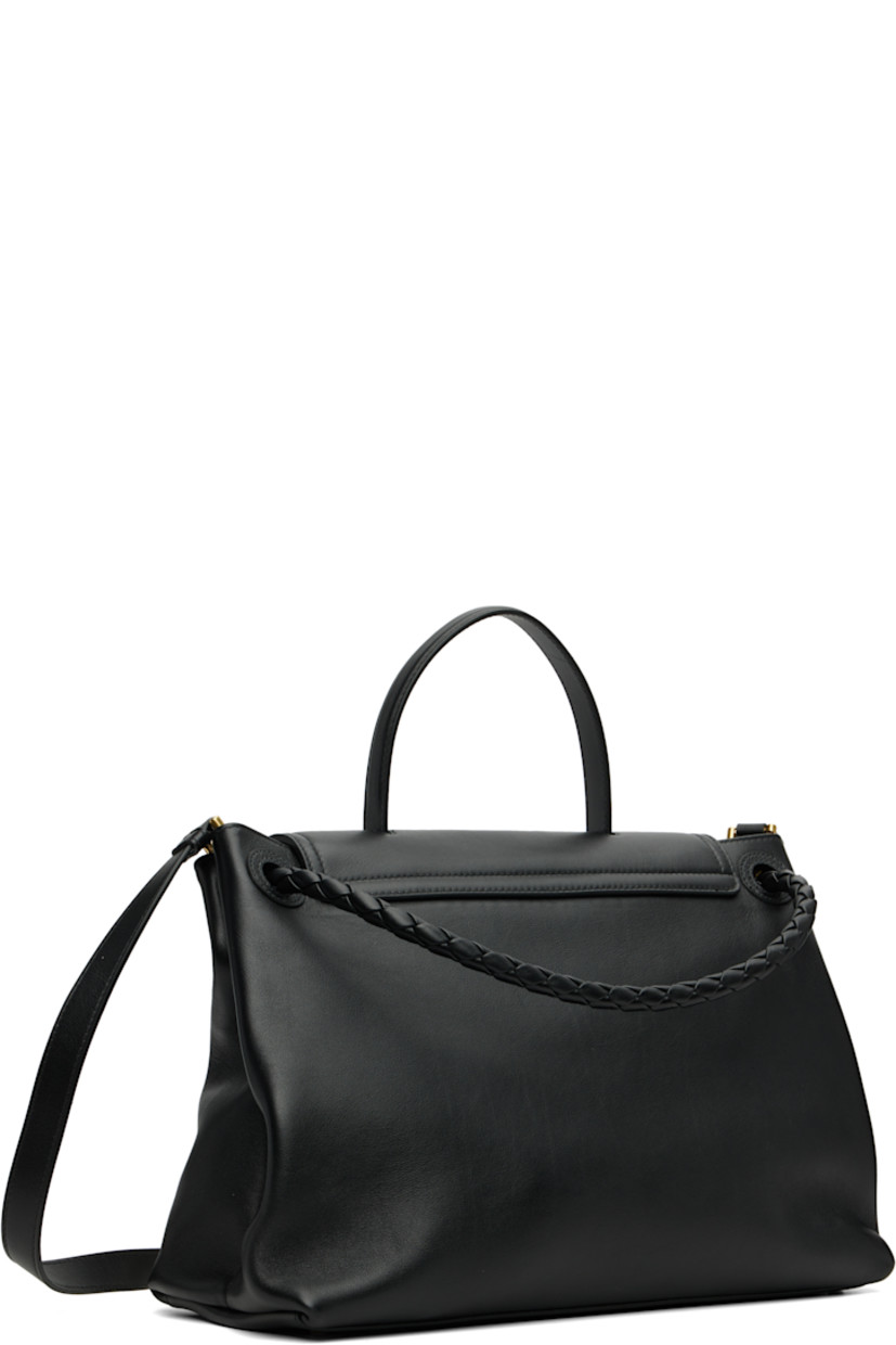 Buffed calfskin top handle bag.

· Fixed carry handle
· Knotted clasp at intrecciato-woven shoulder strap
· Detachable and adjustable crossbody strap
· Bumper studs at base
· Foldover flap with hook-eye fastening
· Alternate fastening at intrecciato-woven interior pocket
· Zip pocket at interior
· Bonded suede lining
· Gold-tone hardware
· H10.25" x W13.5" x D5"

Supplier color: Black