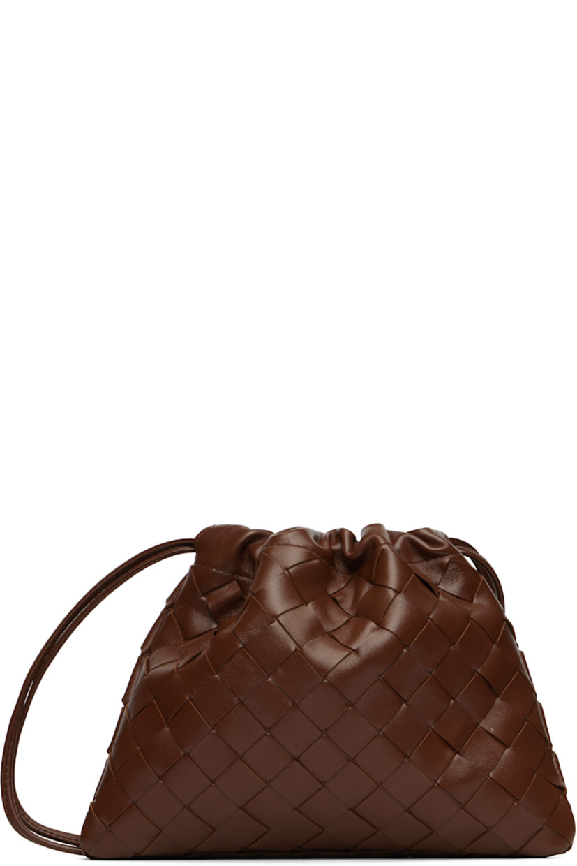 Intrecciato-woven buffed calfskin shoulder bag.

· Twin leather shoulder straps
· Connecting tab at straps for crossbody styling
· Drawstring closure
· Nylon taffeta lining
· H6" x W8" x D1"

Supplier color: Sapele/Gold