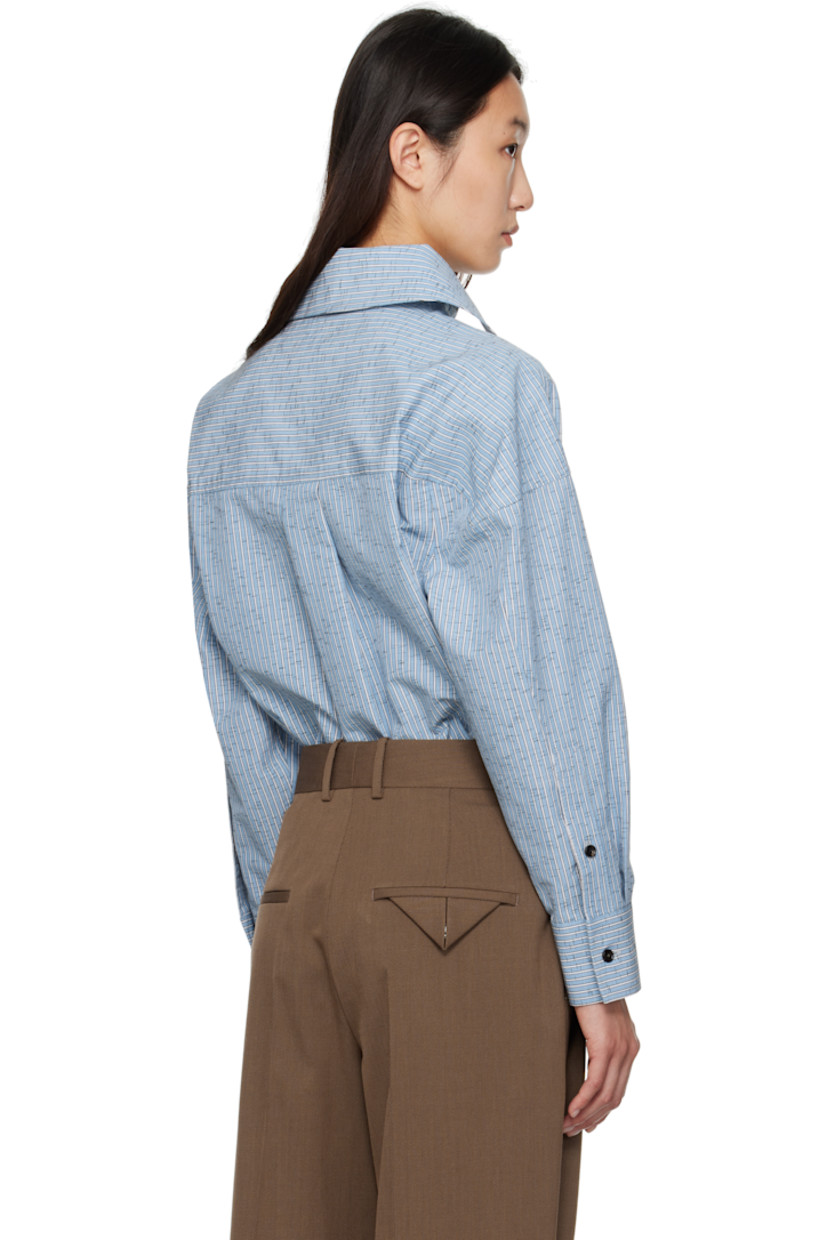 Cotton- and linen-blend dobby cloth shirt.

· Stripe pattern throughout
· Spread collar
· Open placket
· Shirttail hem
· Dropped shoulders
· Buttoned barrel cuffs
· Box pleat at back

Supplier color: Blue/White