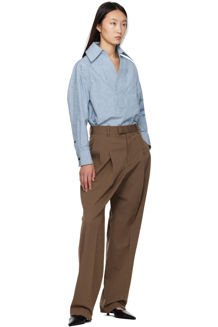 Cotton- and linen-blend dobby cloth shirt.

· Stripe pattern throughout
· Spread collar
· Open placket
· Shirttail hem
· Dropped shoulders
· Buttoned barrel cuffs
· Box pleat at back

Supplier color: Blue/White