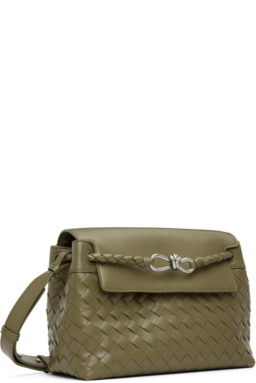 Intrecciato-woven calfskin messenger bag.

· Detachable crossbody strap
· Strap with graphic hardware at face
· Tab-slot flap
· Zip and patch pocket at interior
· Canvas lining
· H9" x W12" x D5"

Supplier color: Algae/Vintage silver