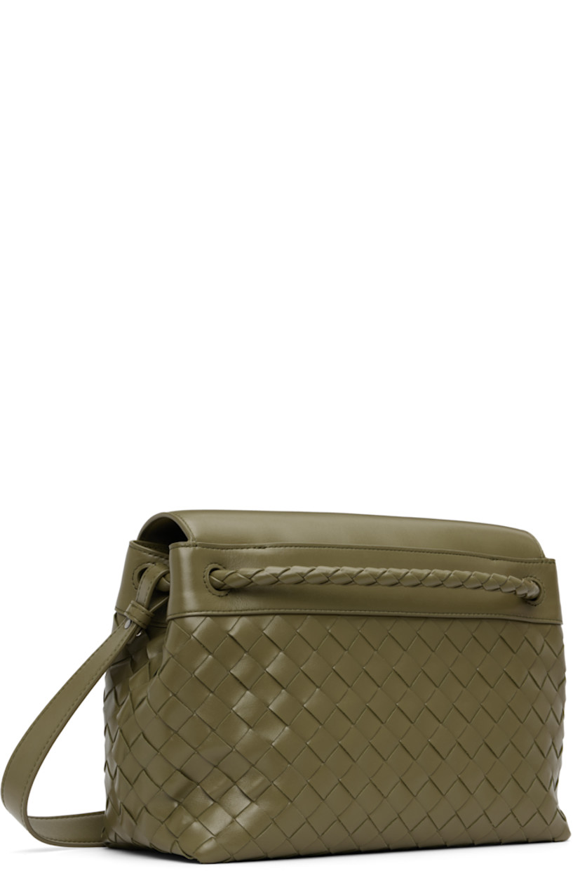 Intrecciato-woven calfskin messenger bag.

· Detachable crossbody strap
· Strap with graphic hardware at face
· Tab-slot flap
· Zip and patch pocket at interior
· Canvas lining
· H9" x W12" x D5"

Supplier color: Algae/Vintage silver