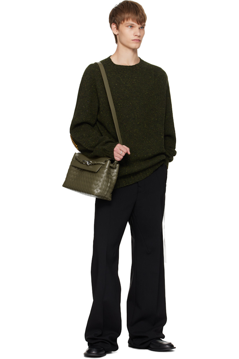 Intrecciato-woven calfskin messenger bag.

· Detachable crossbody strap
· Strap with graphic hardware at face
· Tab-slot flap
· Zip and patch pocket at interior
· Canvas lining
· H9" x W12" x D5"

Supplier color: Algae/Vintage silver