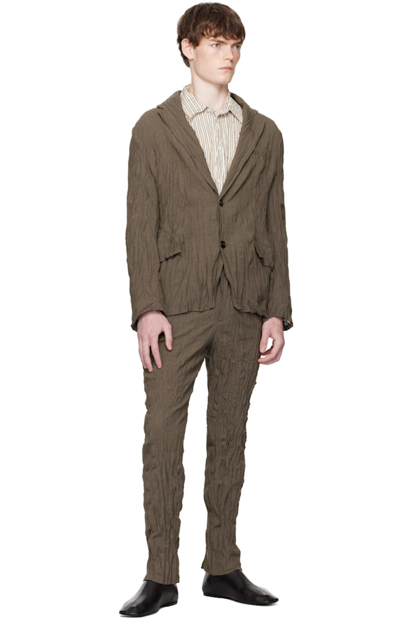 Crinkled stretch wool-blend delaine trousers.

· Slim-fit
· Belt loops
· Four-pocket styling
· Zip fly

Supplier color: Coffee Melange