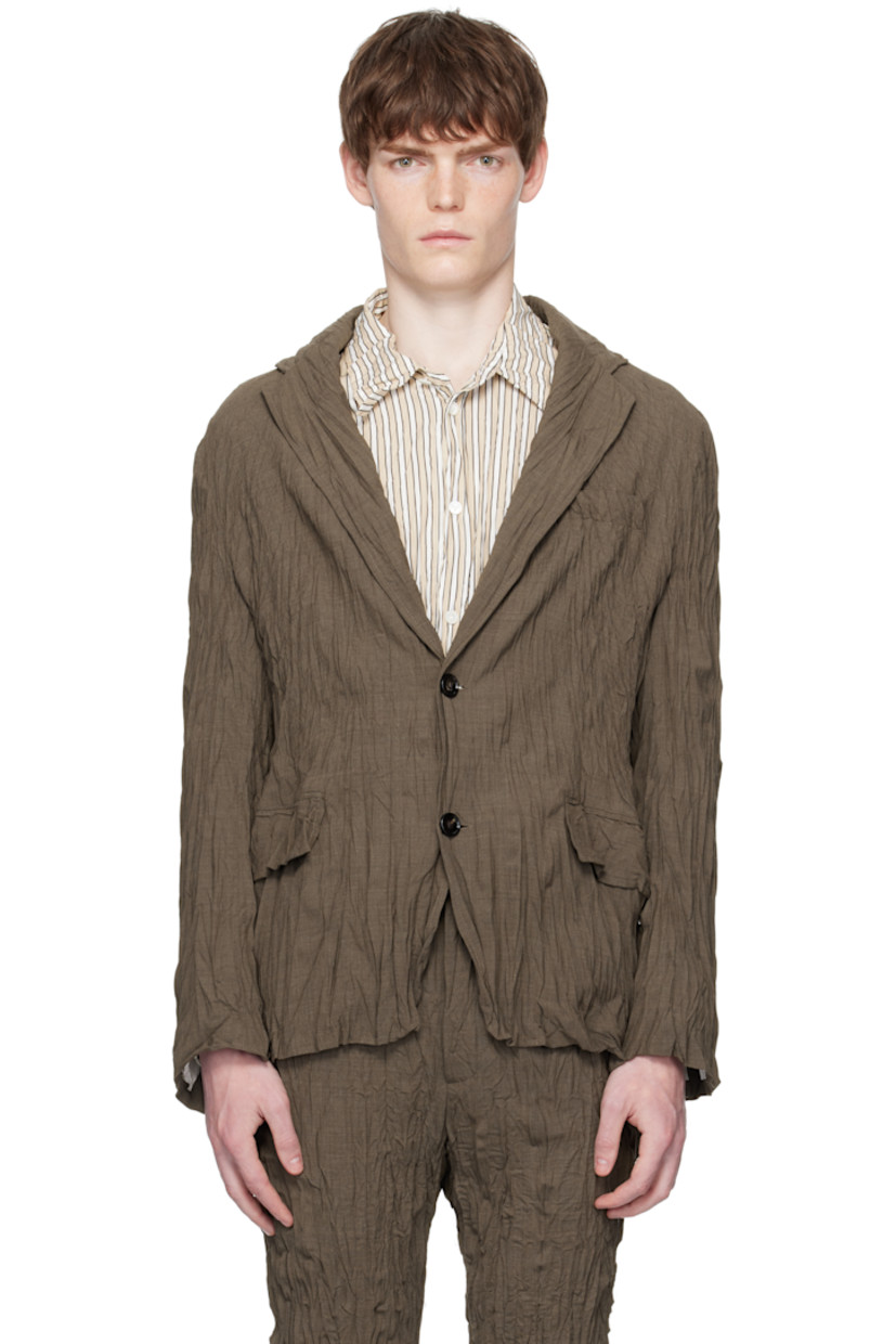 Crinkled stretch wool-blend delaine blazer.

· Notched lapel
· Button closure
· Welt pocket at chest
· Patch pockets at waist
· Buttoned surgeon's cuffs
· Central vent at back hem

Supplier color: Coffee Melange