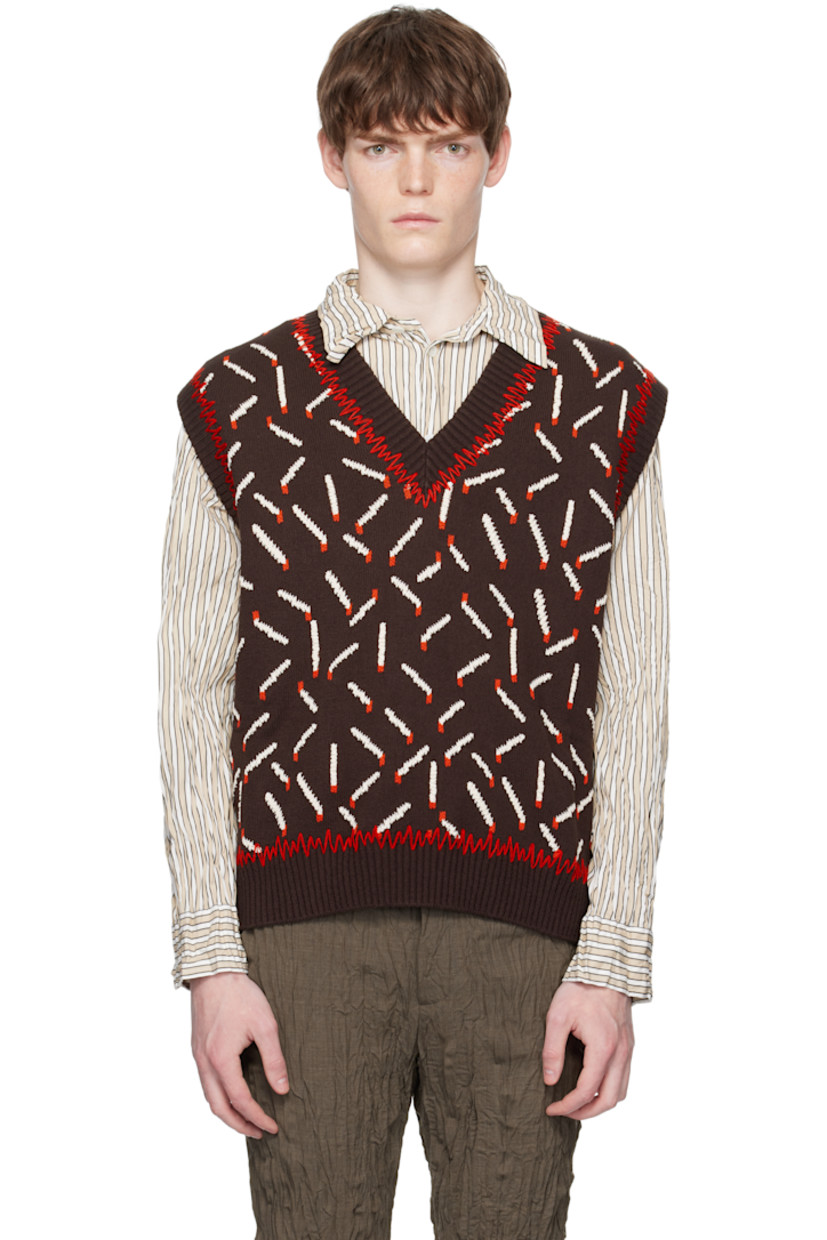 Knit cotton-blend vest.

· Jacquard graphic pattern throughout
· Whipstitching at rib-knit V-neck, hem, and armscyes

Supplier color: Ebony/Chalk/Tomato