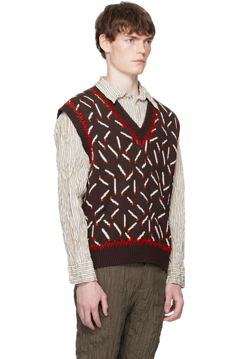 Knit cotton-blend vest.

· Jacquard graphic pattern throughout
· Whipstitching at rib-knit V-neck, hem, and armscyes

Supplier color: Ebony/Chalk/Tomato