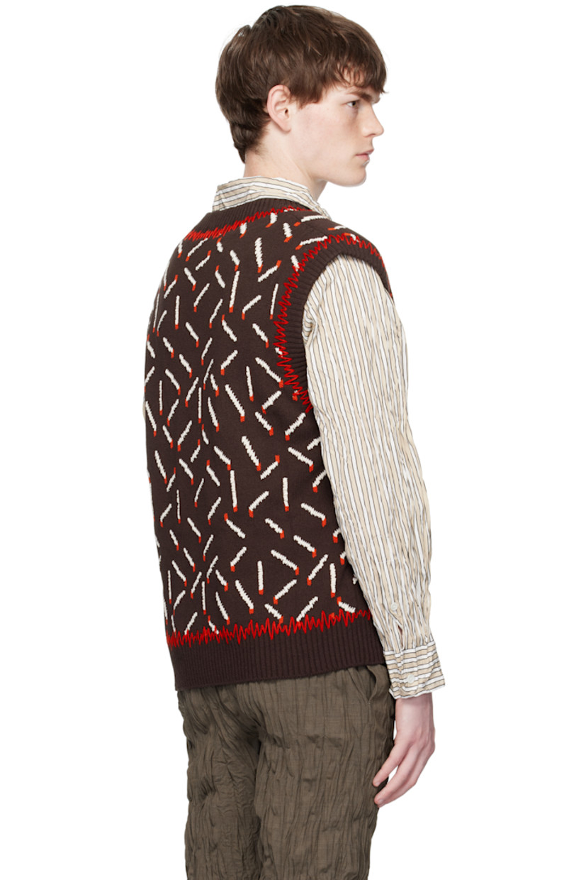 Knit cotton-blend vest.

· Jacquard graphic pattern throughout
· Whipstitching at rib-knit V-neck, hem, and armscyes

Supplier color: Ebony/Chalk/Tomato