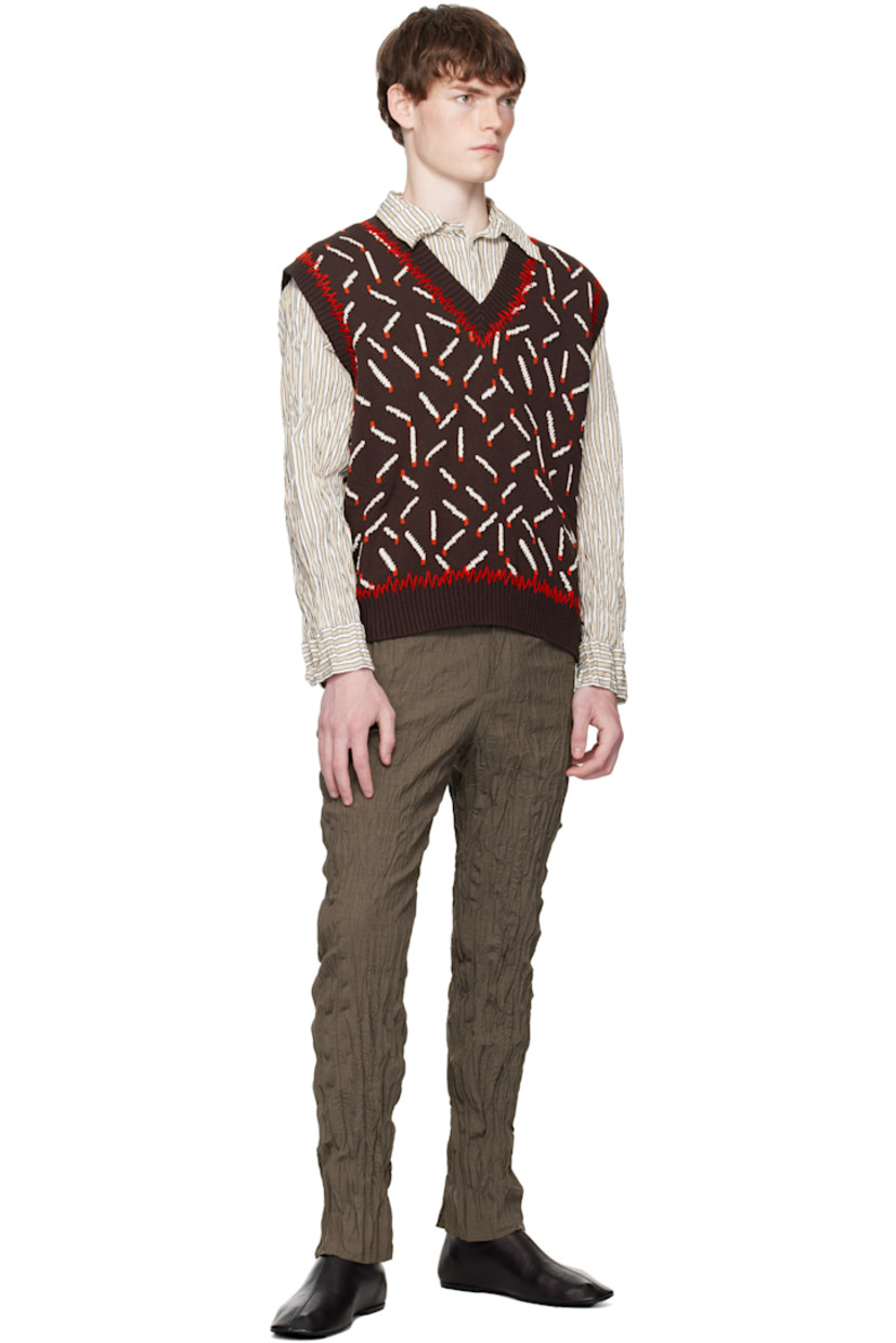 Knit cotton-blend vest.

· Jacquard graphic pattern throughout
· Whipstitching at rib-knit V-neck, hem, and armscyes

Supplier color: Ebony/Chalk/Tomato