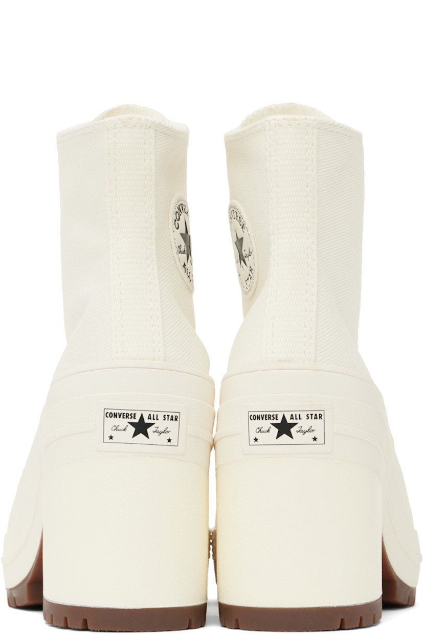 Cotton twill heeled sneakers in white.

· Rubber cap toe
· Lace-up closure
· Logo patch and eyelets at inner side
· Rubberized logo patch at heel
· Canvas lining
· Cushioned OrthoLite® footbed
· Foam rubber block heel
· Treaded rubber sole
· Heel: H3.5"

Supplier color: Egret/Egret/Black