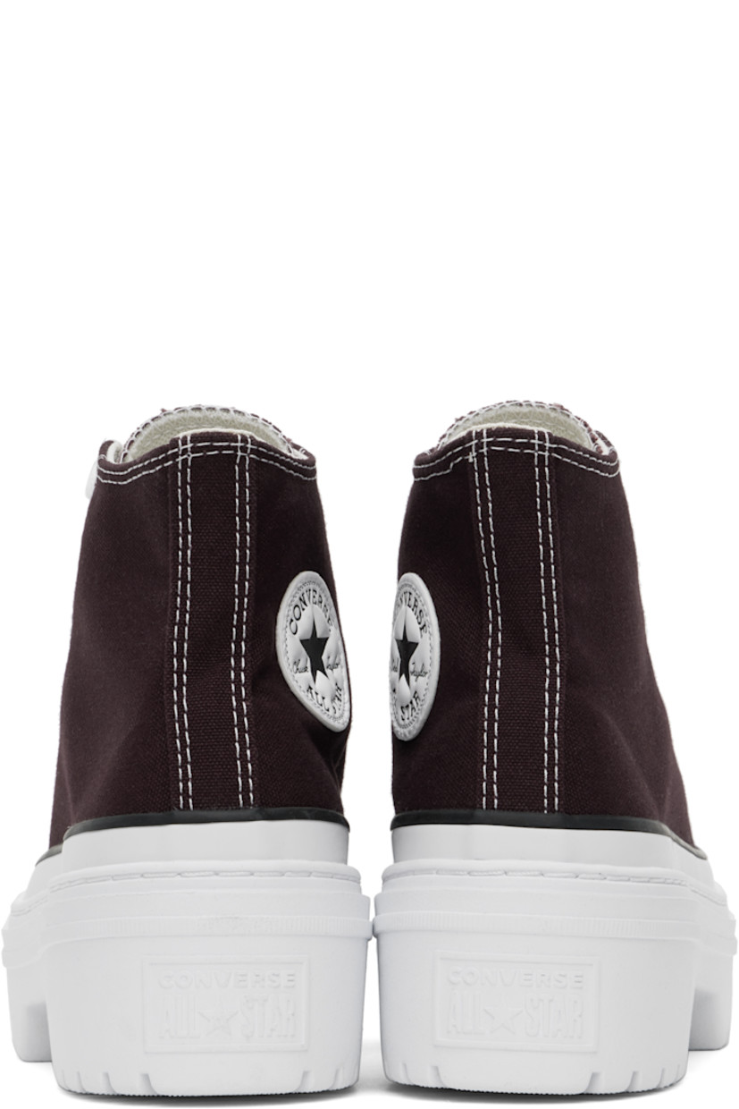 High-top canvas sneakers in burgundy.

· Rubber cap toe
· Lace-up closure
· Logo patch at inner side
· Cushioned OrthoLite® footbed
· Mesh lining
· Logo embossed at heel
· Lugged rubber platform sole
· Contrast stitching in white
· Platform: H2"

Supplier color: Bloodstone/White/Black